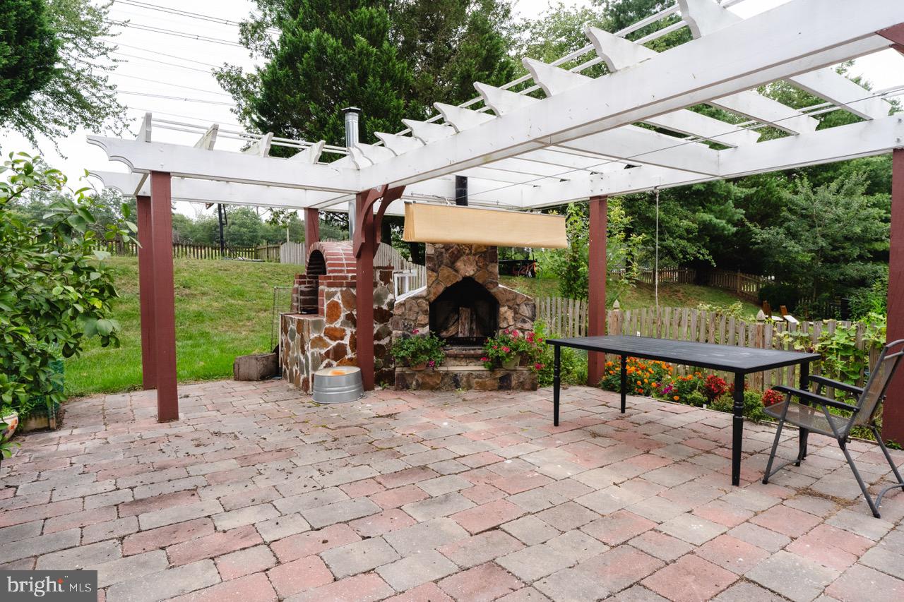 18278 Maple Spring Court Leesburg, VA 20176 - Photo 28 of 35 Charming outdoor patio with fireplace.