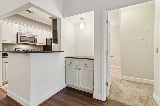 a kitchen with stainless steel appliances a refrigerator and sink