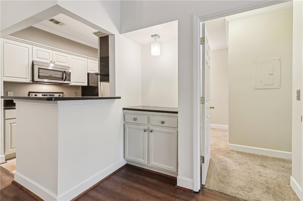 3071 Lenox Road Northeast, Unit 8 Atlanta, GA 30324 - Photo 18 of 50 a kitchen with stainless steel appliances a refrigerator and sink