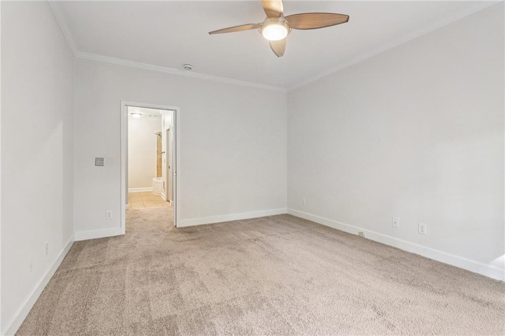 3071 Lenox Road Northeast, Unit 8 Atlanta, GA 30324 - Photo 22 of 50 an empty room with fan