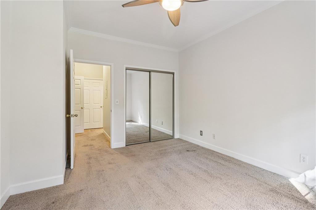 3071 Lenox Road Northeast, Unit 8 Atlanta, GA 30324 - Photo 29 of 50 an empty room with fan