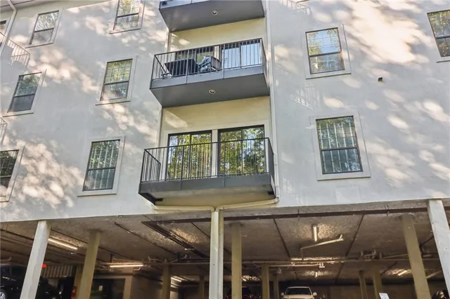 a view of a building with a yard