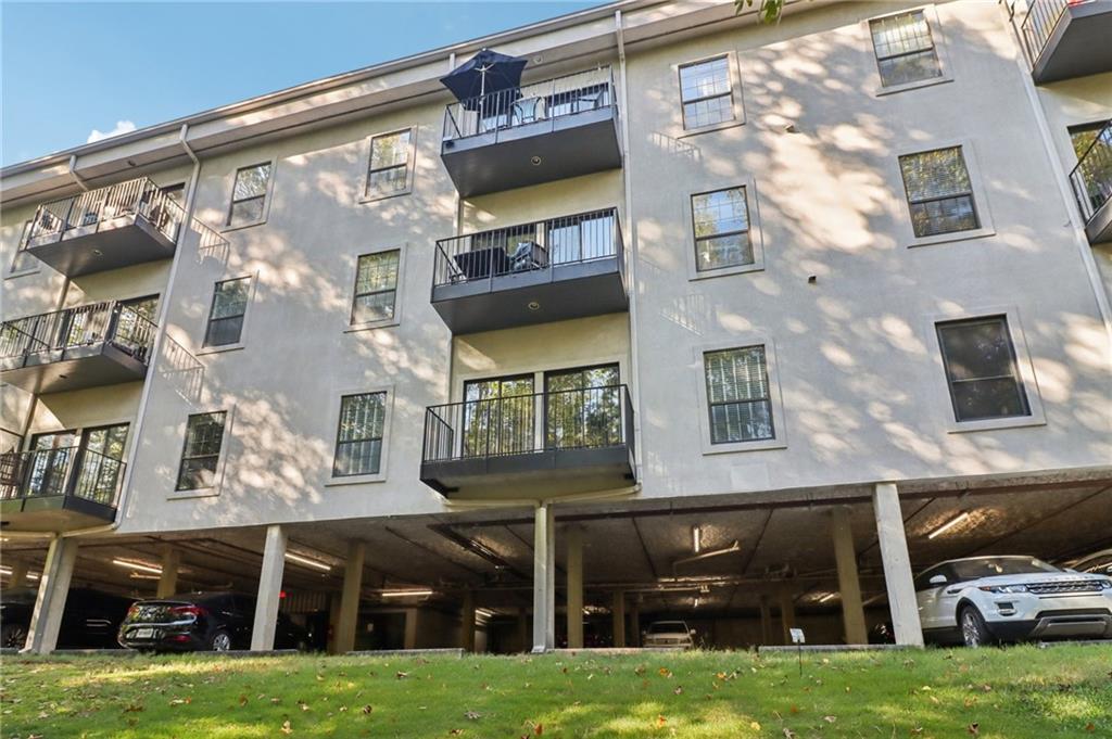 3071 Lenox Road Northeast, Unit 8 Atlanta, GA 30324 - Photo 38 of 50 a view of a building with a yard