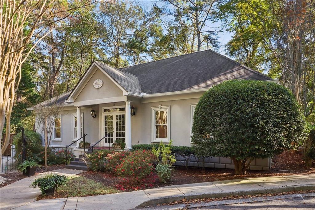 3071 Lenox Road Northeast, Unit 8 Atlanta, GA 30324 - Photo 43 of 50 a front view of a house with garden