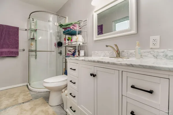a bathroom with a sink toilet and vanity