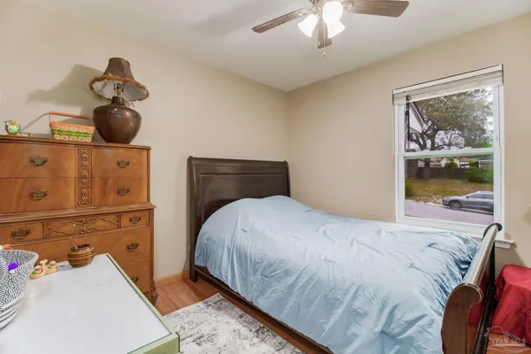 a bedroom with a bed and cabinets