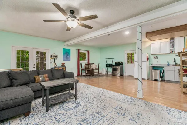 a living room with furniture and a large window