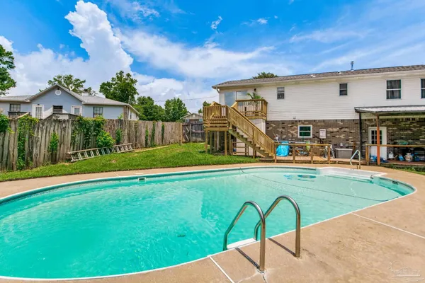 a view of a house with a swimming pool