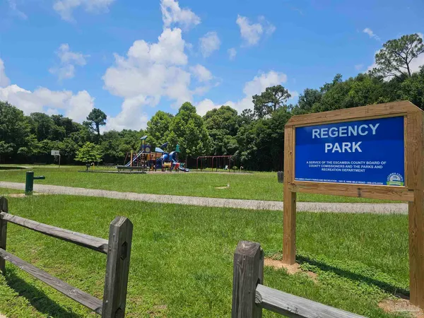 a view of a park with welcome board