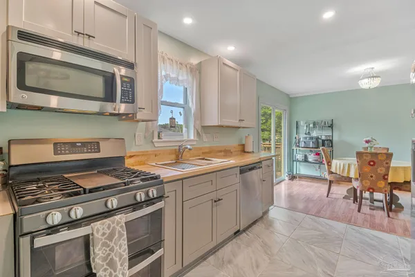 a kitchen with a stove and a microwave