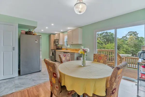 a view of a dining room with furniture window and outside view