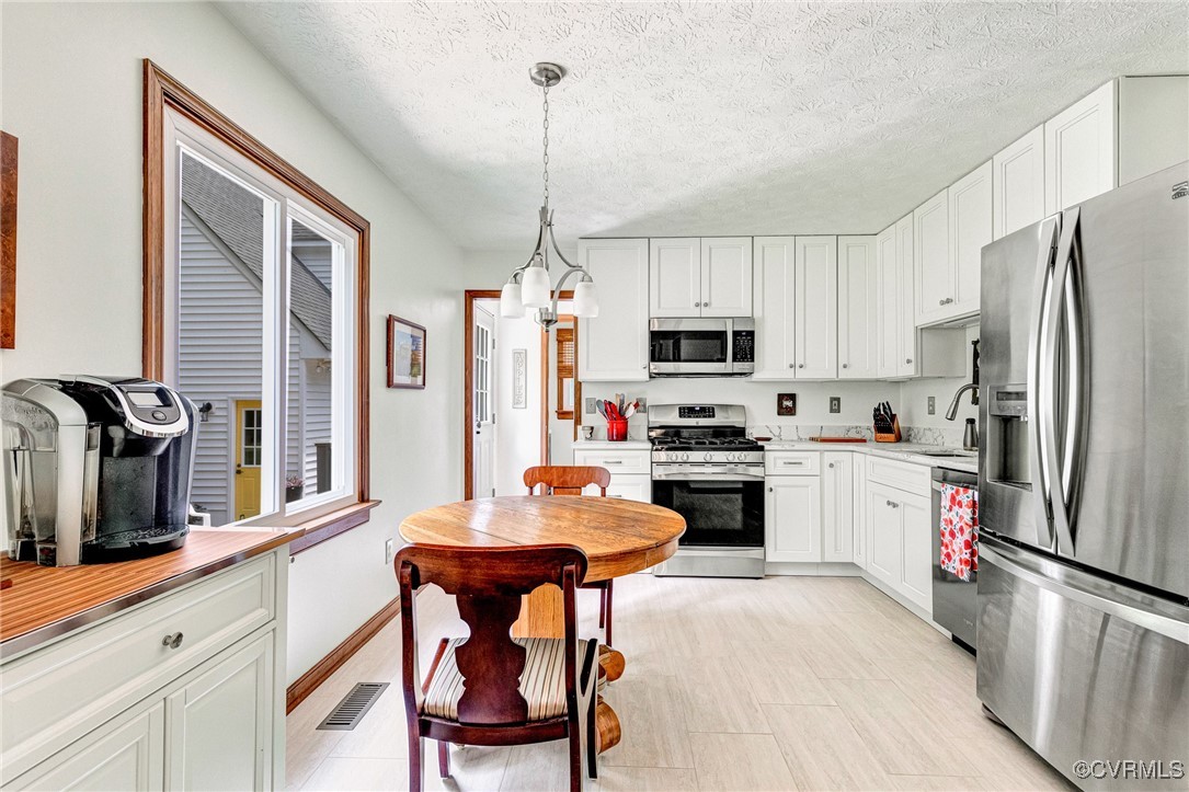 11384 Georgetown Road Mechanicsville, VA 23116 - Photo 15 of 49 Kitchen with stainless steel appliances, light cou
