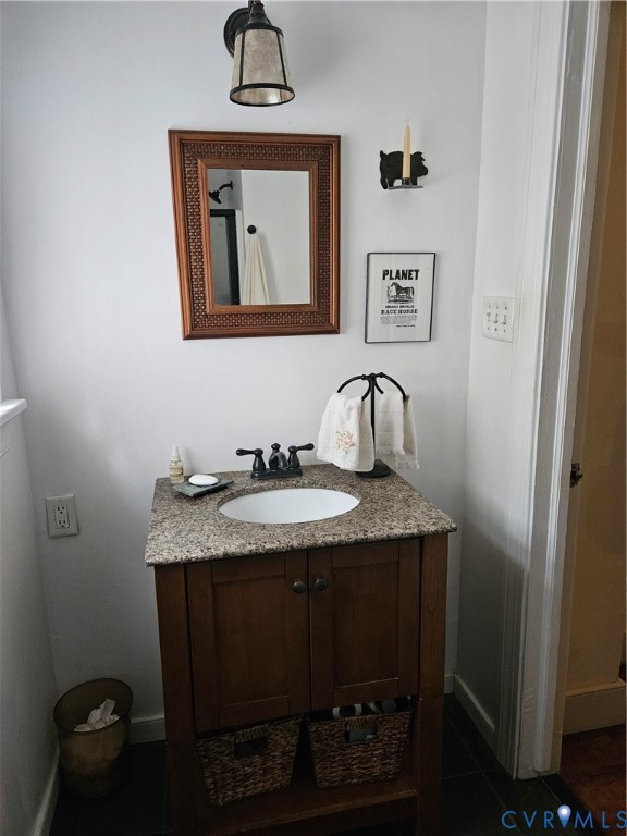 12262 Welling Hall Road Doswell, VA 23047 - Photo 12 of 42 a bathroom with a granite countertop sink and a mirror