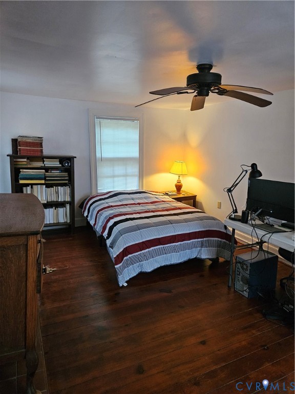 12262 Welling Hall Road Doswell, VA 23047 - Photo 23 of 42 a bedroom with a bed and a chandelier