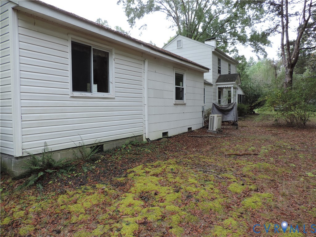 12262 Welling Hall Road Doswell, VA 23047 - Photo 30 of 42 a view of a house with a yard