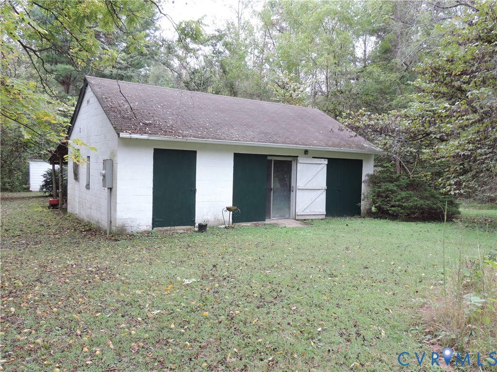 12262 Welling Hall Road Doswell, VA 23047 - Photo 34 of 42 a house that has a tree in front of it