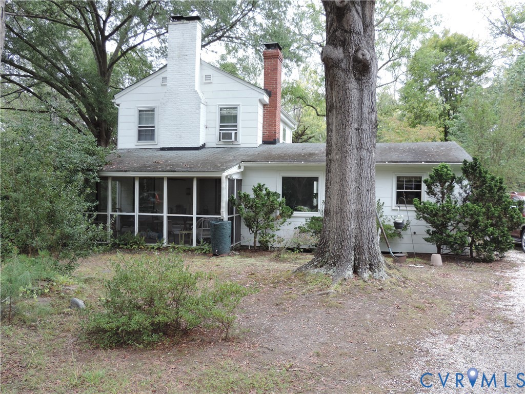 12262 Welling Hall Road Doswell, VA 23047 - Photo 37 of 42 a house with trees in front of it