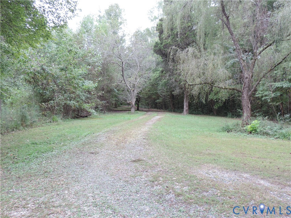 12262 Welling Hall Road Doswell, VA 23047 - Photo 38 of 42 a view of a field with trees in the background