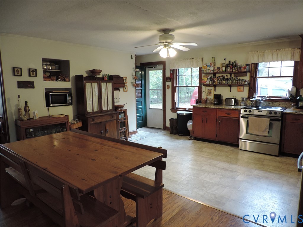 12262 Welling Hall Road Doswell, VA 23047 - Photo 4 of 42 a living room with kitchen island furniture and a kitchen view