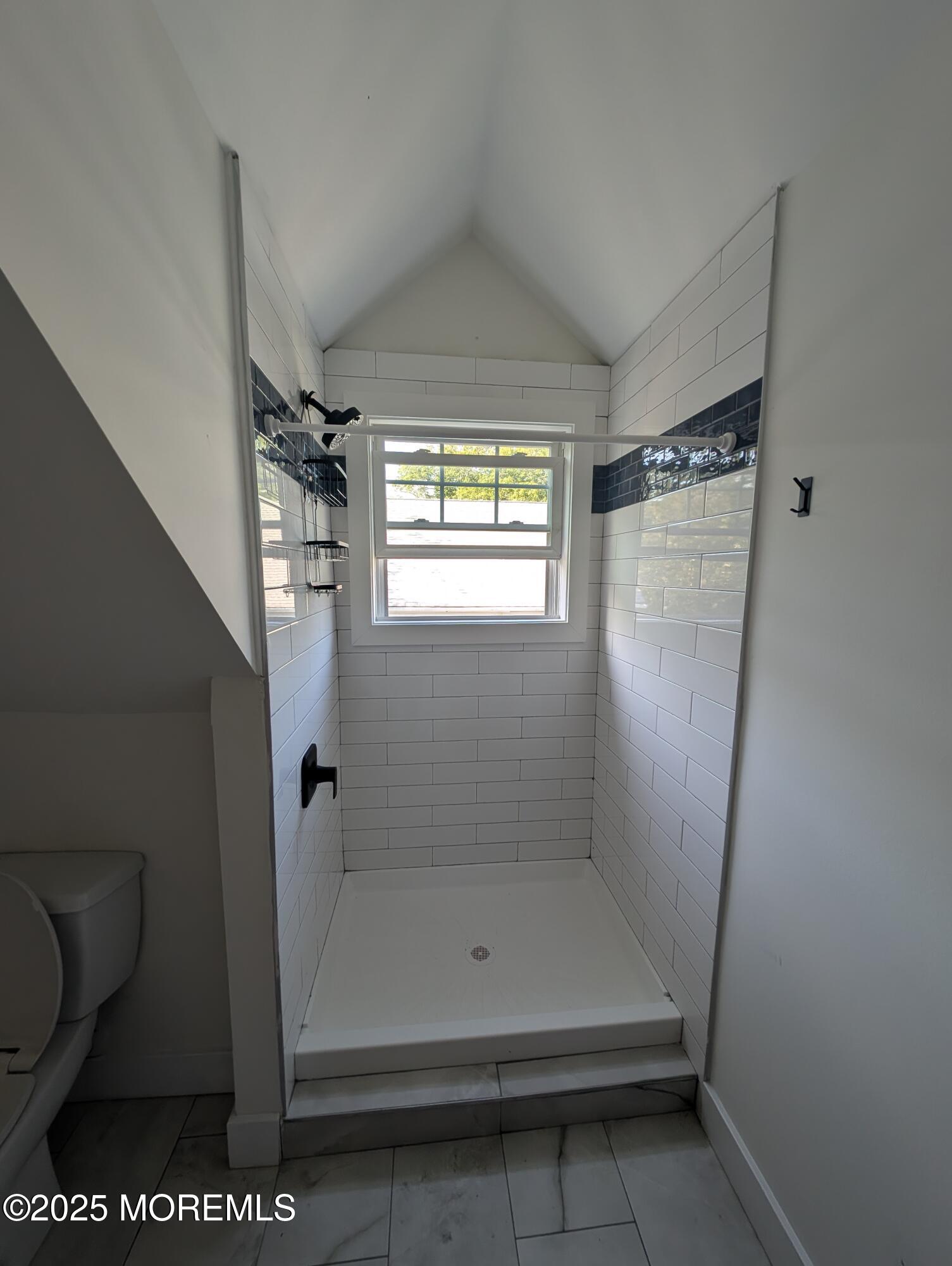 180 Hudson Avenue Red Bank, NJ 07701 - Photo 16 of 18 a bathroom with a glass shower door