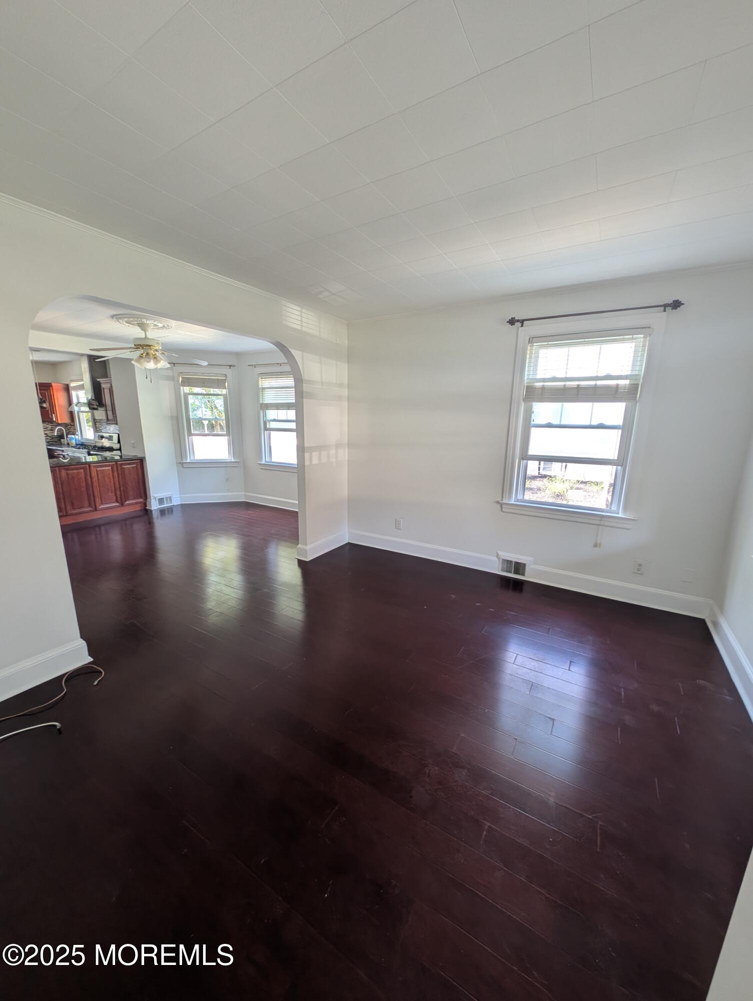180 Hudson Avenue Red Bank, NJ 07701 - Photo 8 of 18 an empty room with wooden floor and windows