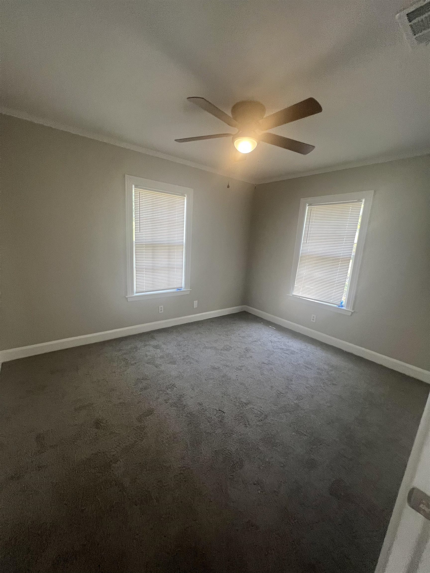 3578 Carrington Road Memphis, TN 38111 - Photo 6 of 11 an empty room with a window and fireplace