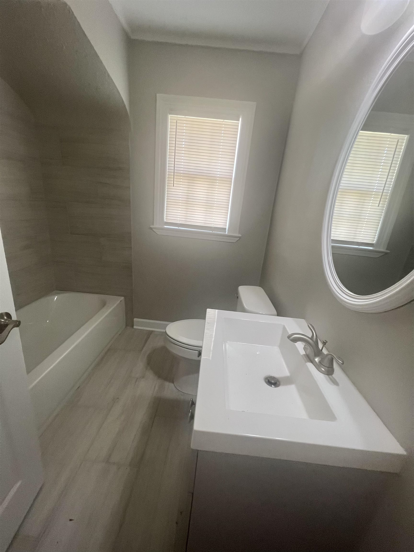 3578 Carrington Road Memphis, TN 38111 - Photo 8 of 11 a bathroom with a sink a toilet and a bathtub