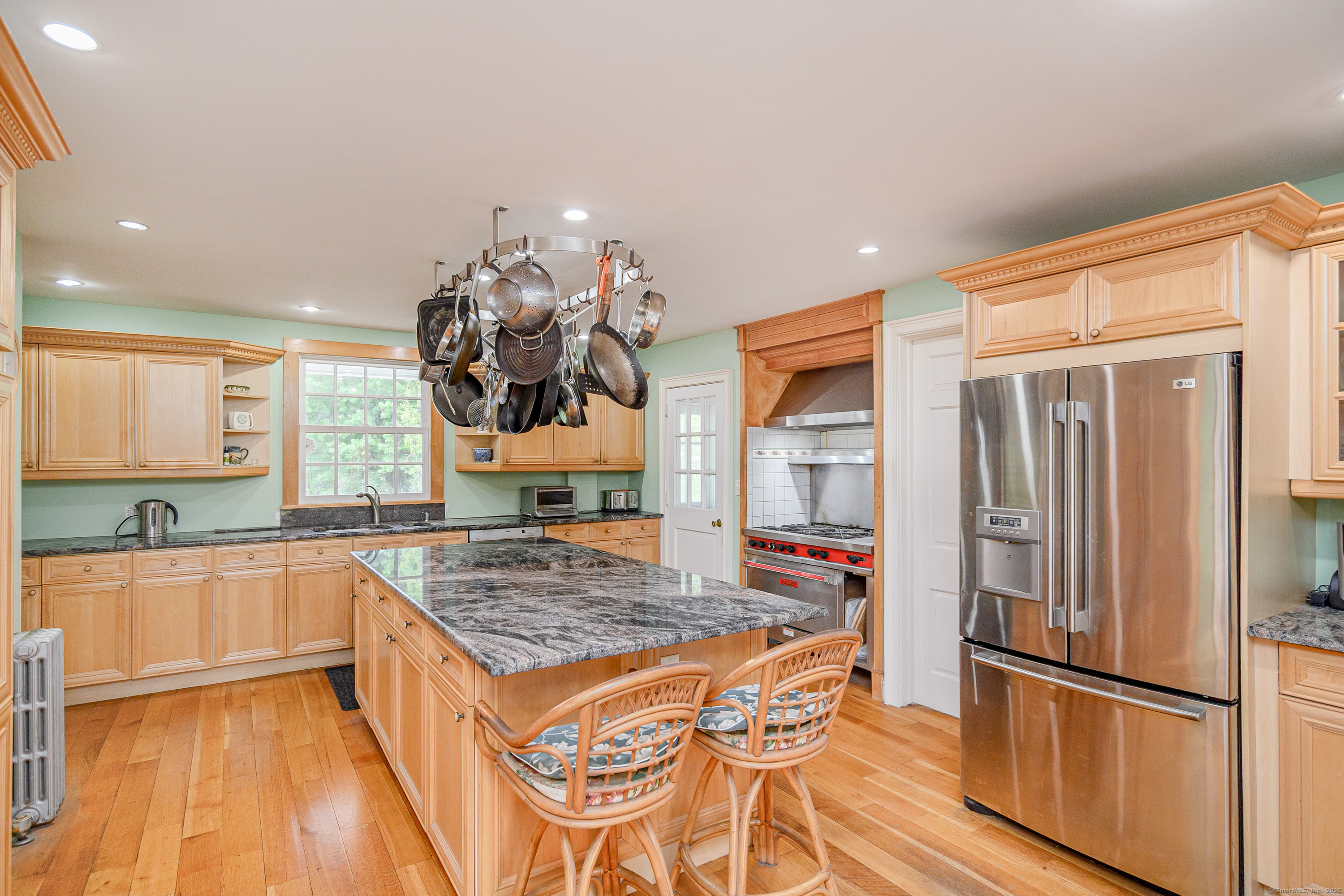 49 Great Ring Road Newtown, CT 06482 - Photo 13 of 40 a kitchen with stainless steel appliances granite countertop a refrigerator and a sink