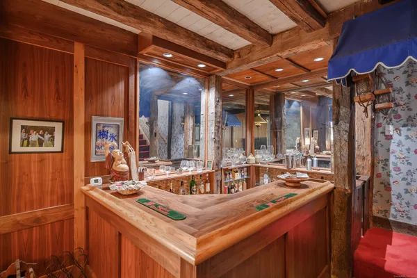 a dining room with furniture window and outside view