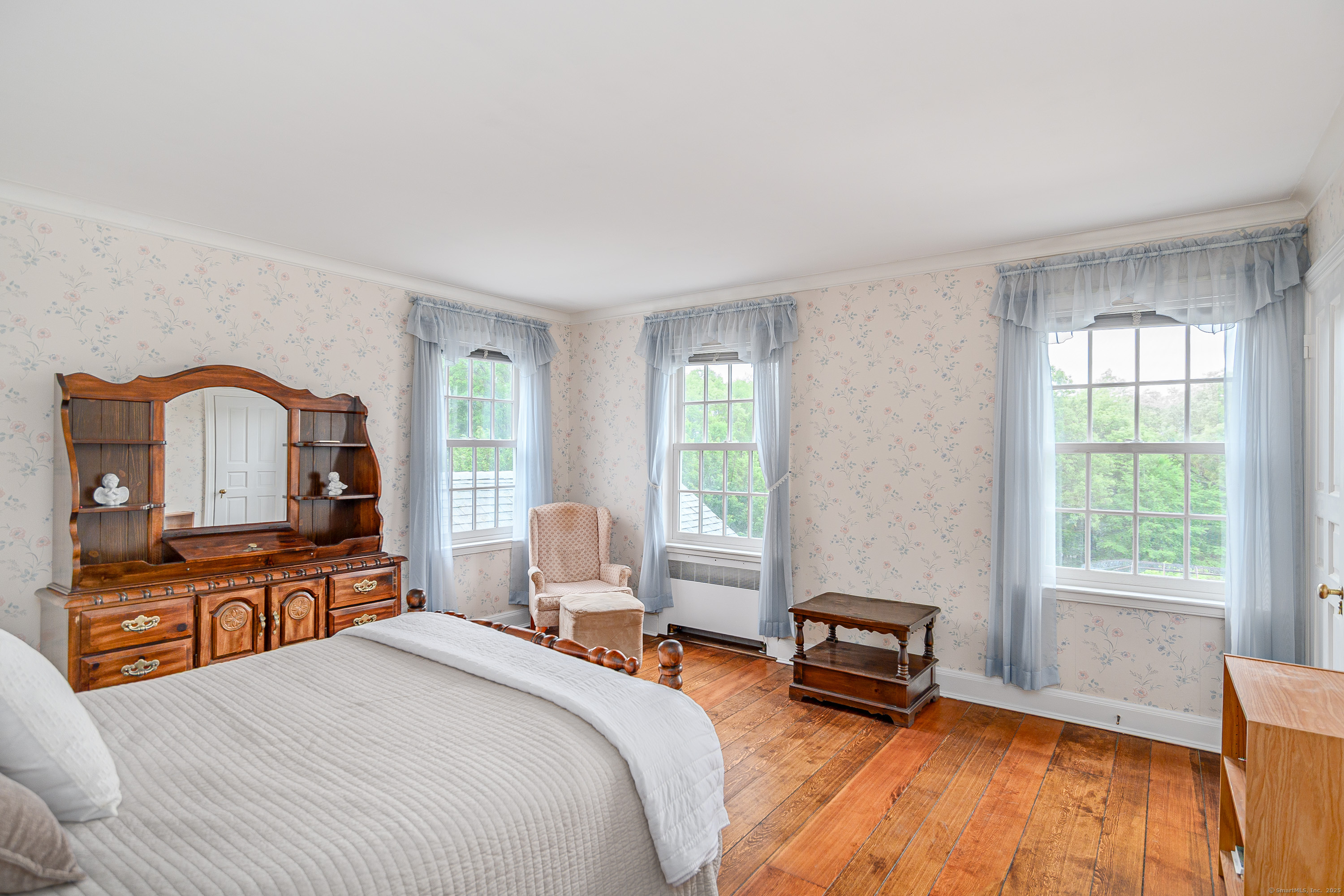 49 Great Ring Road Newtown, CT 06482 - Photo 2 of 40 a bedroom with a bed a flat tv screen and a dresser