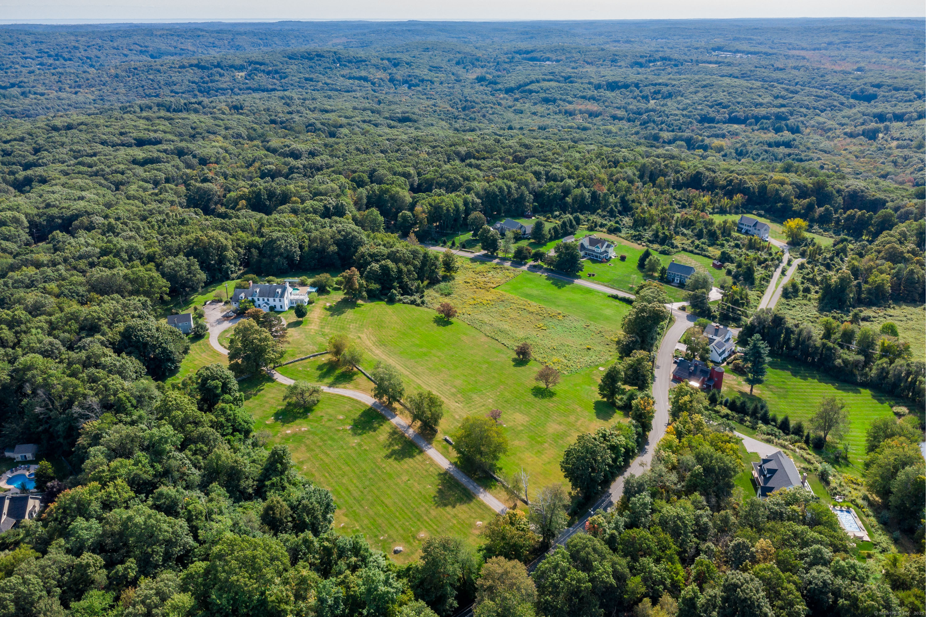 49 Great Ring Road Newtown, CT 06482 - Photo 23 of 40 an aerial view of residential houses with outdoor space and trees