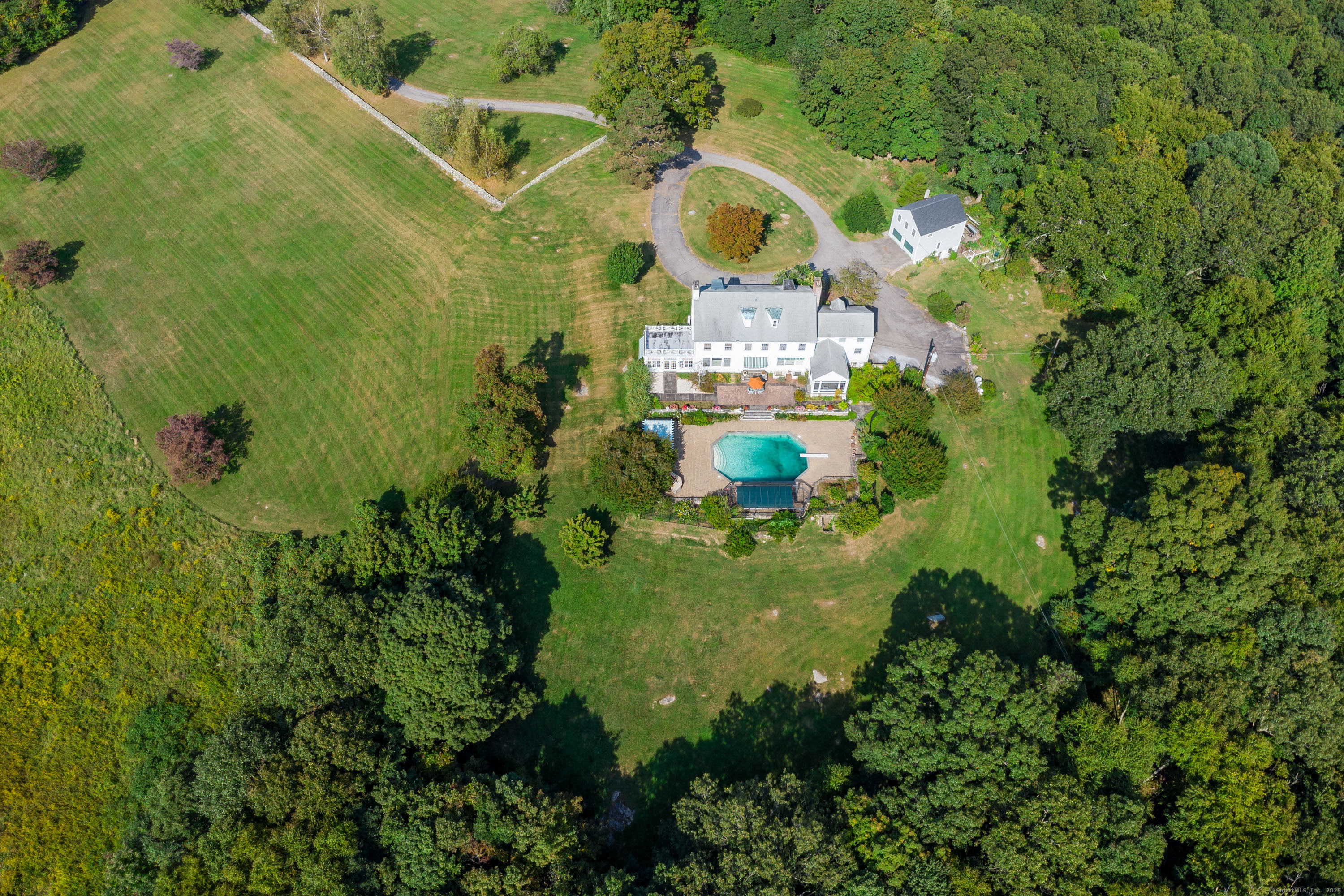 49 Great Ring Road Newtown, CT 06482 - Photo 29 of 40 a view of a house with a swimming pool