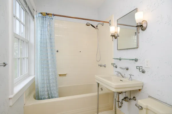 a bathroom with a sink and a bathtub