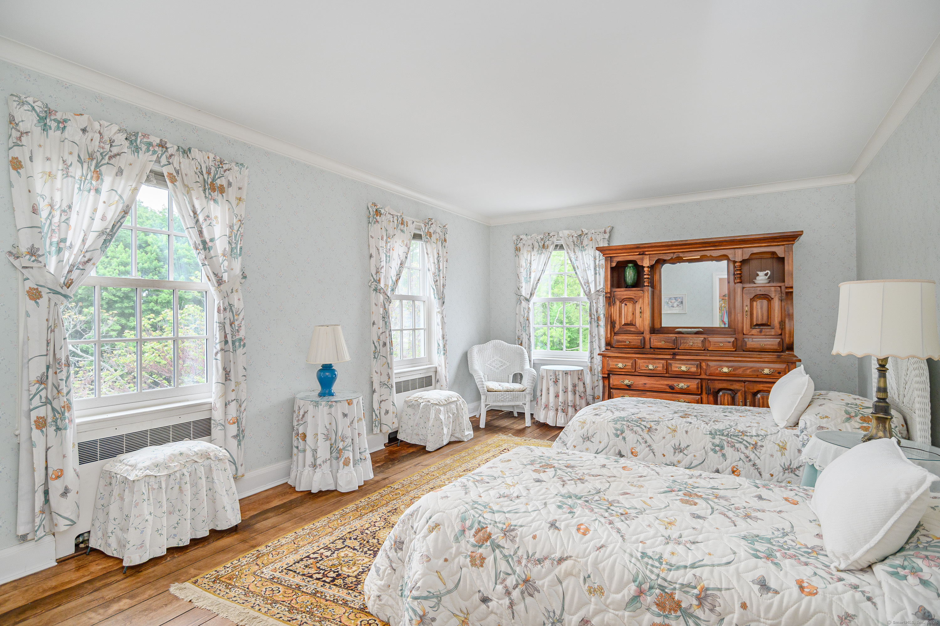 49 Great Ring Road Newtown, CT 06482 - Photo 4 of 40 a bedroom with a large bed and wooden floor