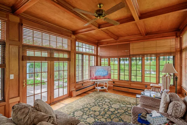 a living room with furniture and a rug
