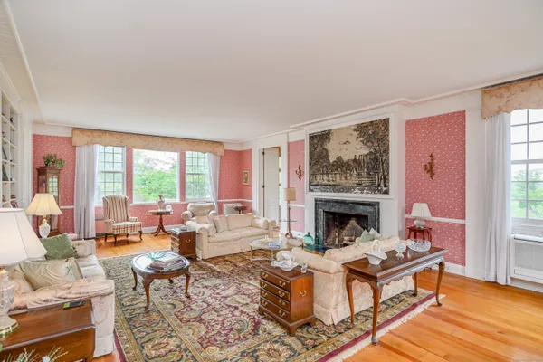 a living room with fireplace furniture and a fireplace