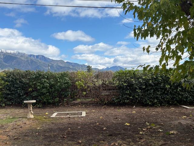 910 Mercer Avenue Ojai, CA 93023 - Photo 3 of 21 a view of a street with a building in the background