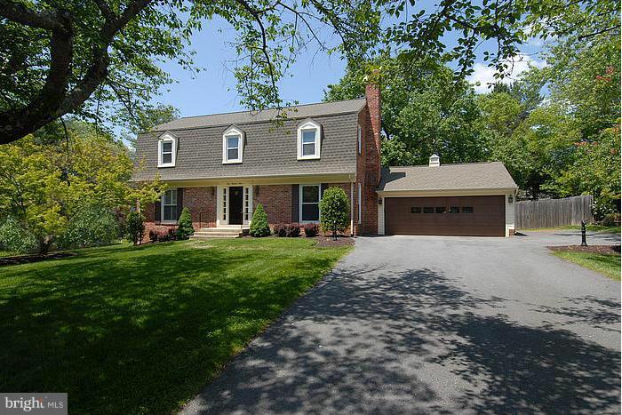 409 Highgate Terrace Silver Spring, MD 20904 - Photo 1 of 30 a front view of a house with a garden and trees