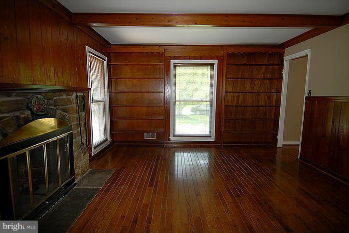 409 Highgate Terrace Silver Spring, MD 20904 - Photo 11 of 30 a view of empty room with wooden floor and fan