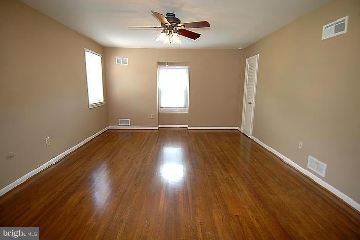 409 Highgate Terrace Silver Spring, MD 20904 - Photo 15 of 30 wooden floor in an empty room with a window