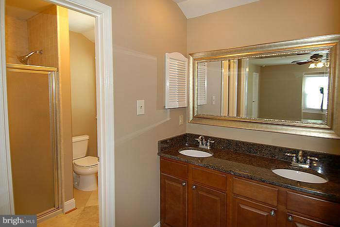 409 Highgate Terrace Silver Spring, MD 20904 - Photo 16 of 30 a bathroom with a sink a toilet and a mirror