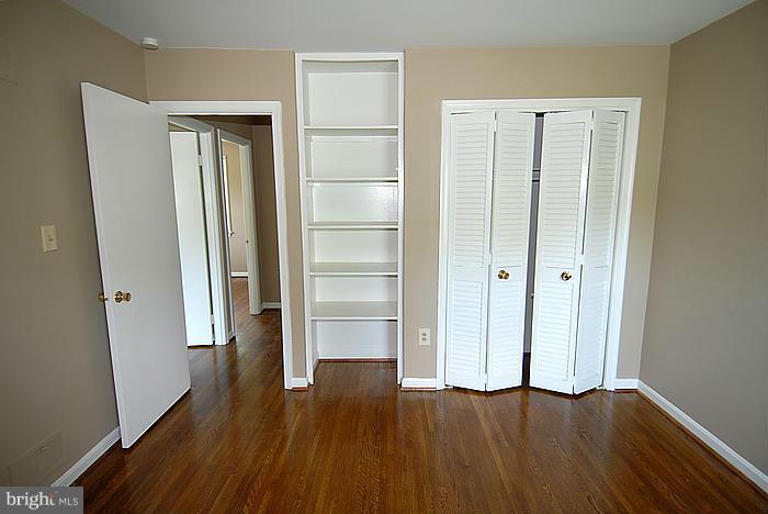 409 Highgate Terrace Silver Spring, MD 20904 - Photo 20 of 30 an empty room with wooden floor & closet area