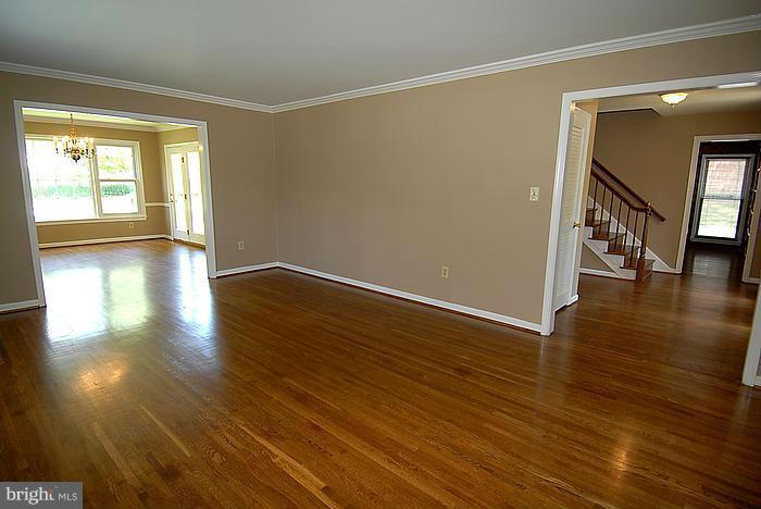 409 Highgate Terrace Silver Spring, MD 20904 - Photo 3 of 30 a view of an empty room with wooden floor and a window