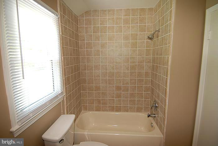 409 Highgate Terrace Silver Spring, MD 20904 - Photo 23 of 30 a bathroom with a bathtub and window