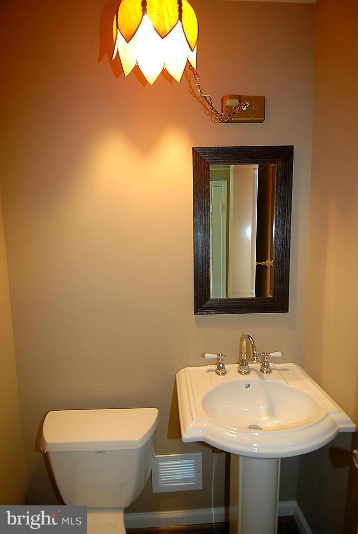 409 Highgate Terrace Silver Spring, MD 20904 - Photo 25 of 30 a bathroom with a sink and a mirror