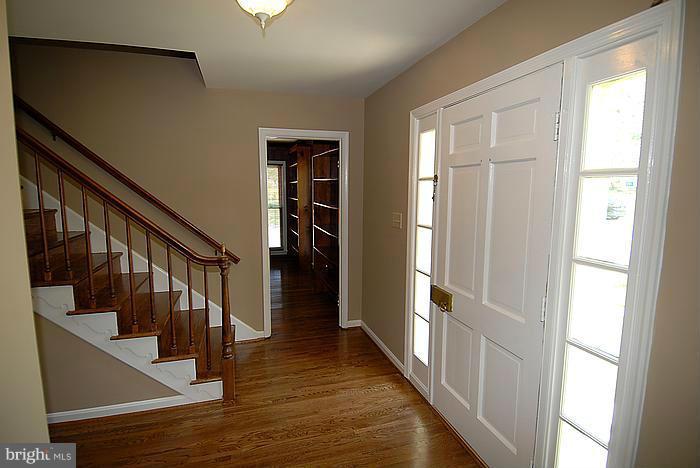 409 Highgate Terrace Silver Spring, MD 20904 - Photo 4 of 30 a view of an entryway with wooden floor and door