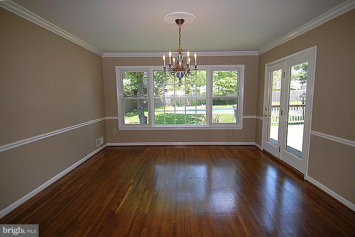 409 Highgate Terrace Silver Spring, MD 20904 - Photo 5 of 30 a view of an empty room with wooden floor and a window