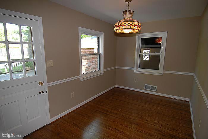 409 Highgate Terrace Silver Spring, MD 20904 - Photo 6 of 30 a view of a room with wooden floor and a window