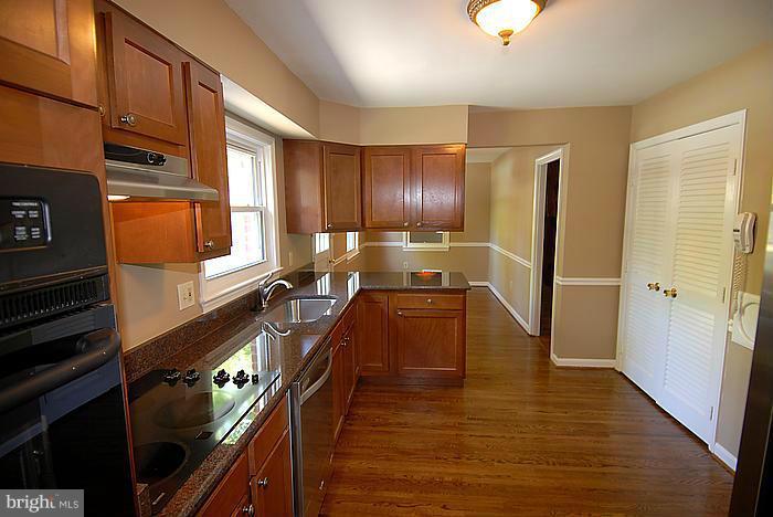 409 Highgate Terrace Silver Spring, MD 20904 - Photo 7 of 30 a kitchen with stainless steel appliances a refrigerator and a stove