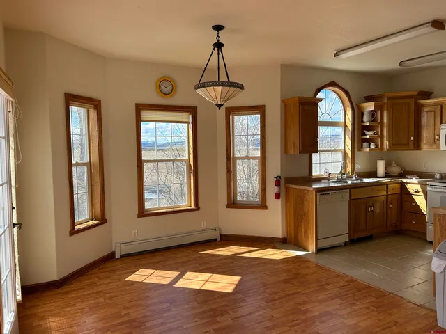 a kitchen with a stove a refrigerator and a sink